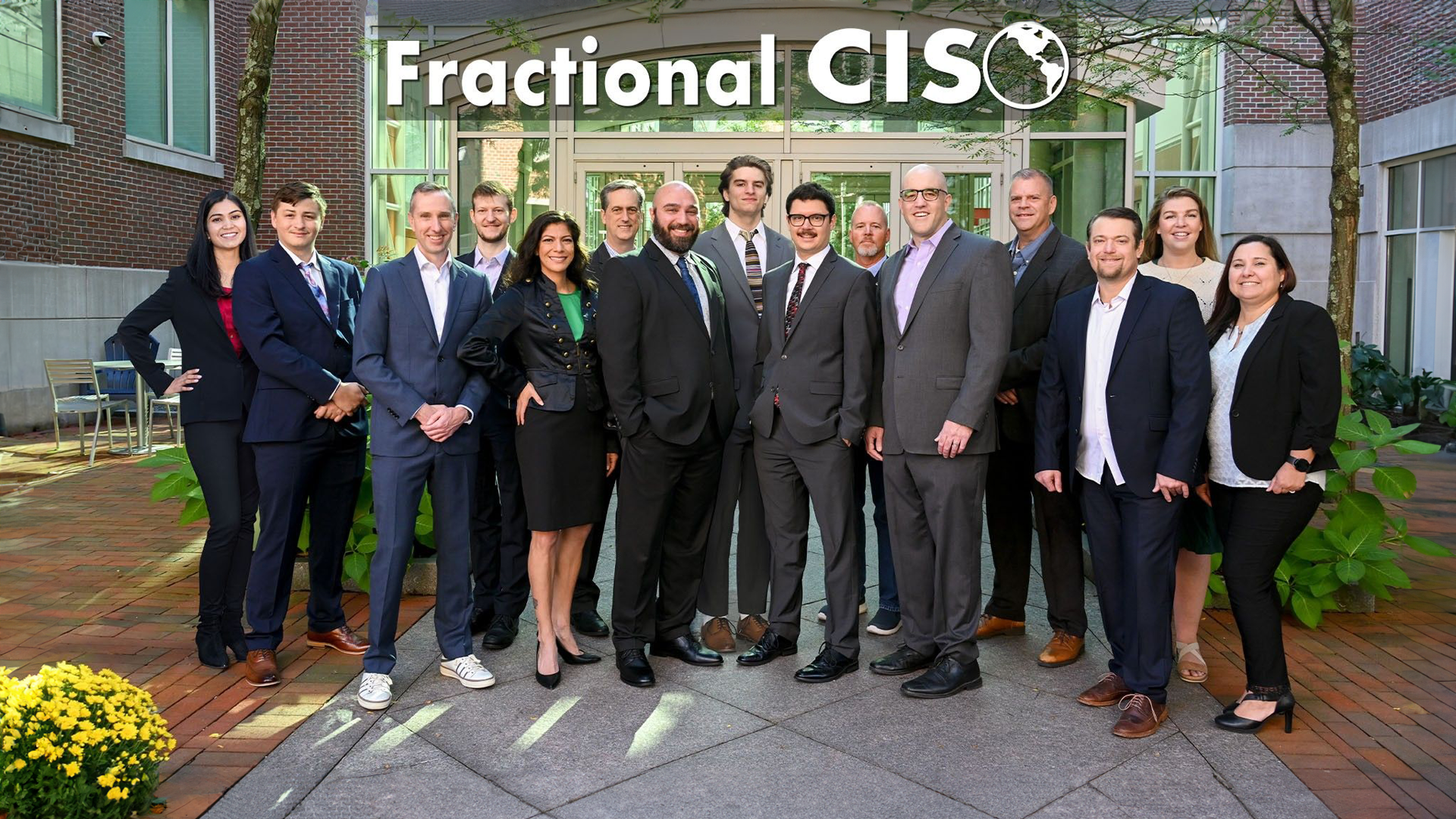 The Fractional CISO team of about 15 people, all standing posing for a picture. They are our virtual CISO team